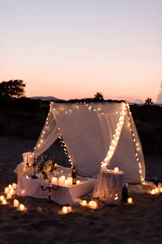 A small tent lit at sunset